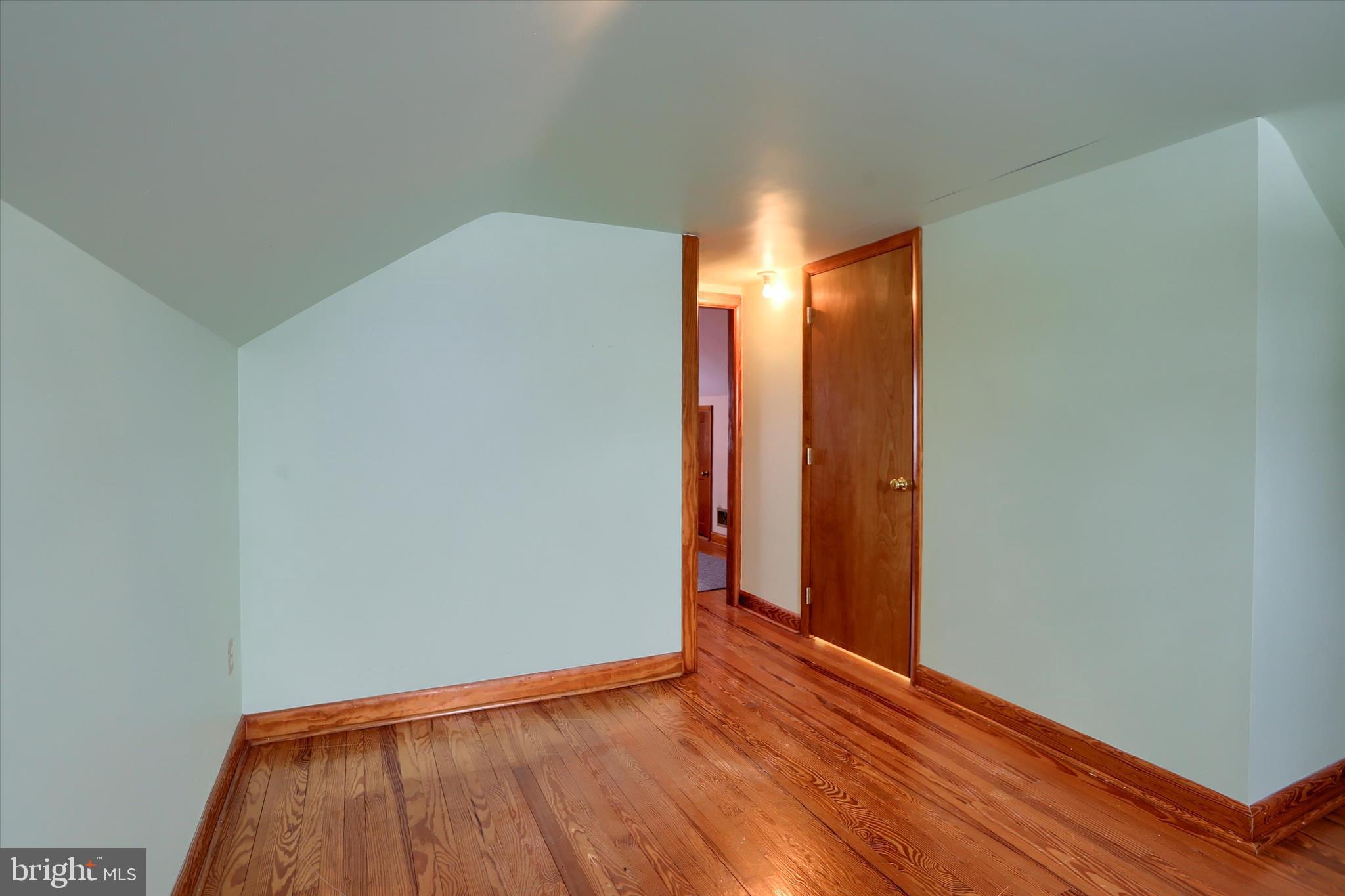678 Littlestown Road Littlestown, PA 17340 - Photo 22 of 55 a view of an empty room with closet and wooden floor