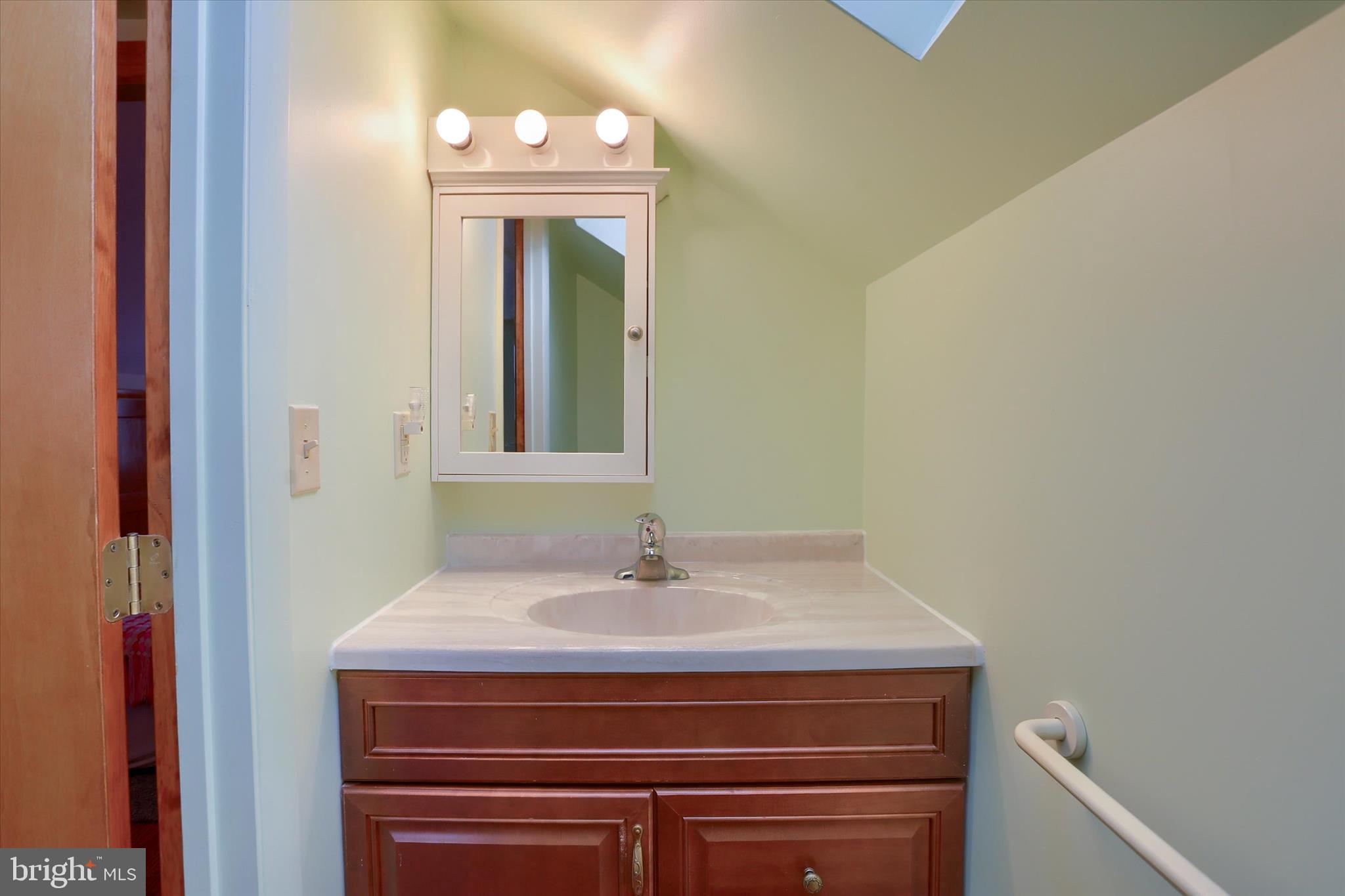 678 Littlestown Road Littlestown, PA 17340 - Photo 26 of 55 a bathroom with a sink and a mirror