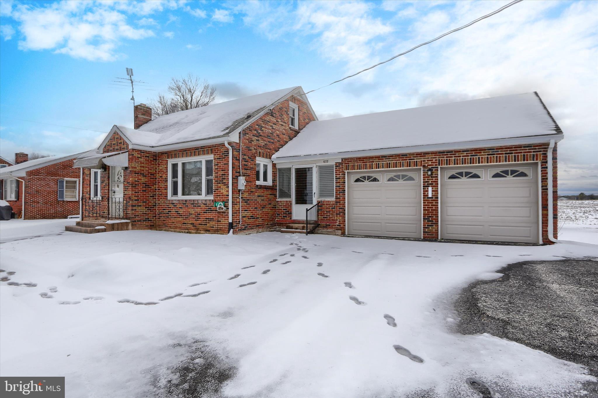 678 Littlestown Road Littlestown, PA 17340 - Photo 3 of 55 a view of a house with a wooden fence
