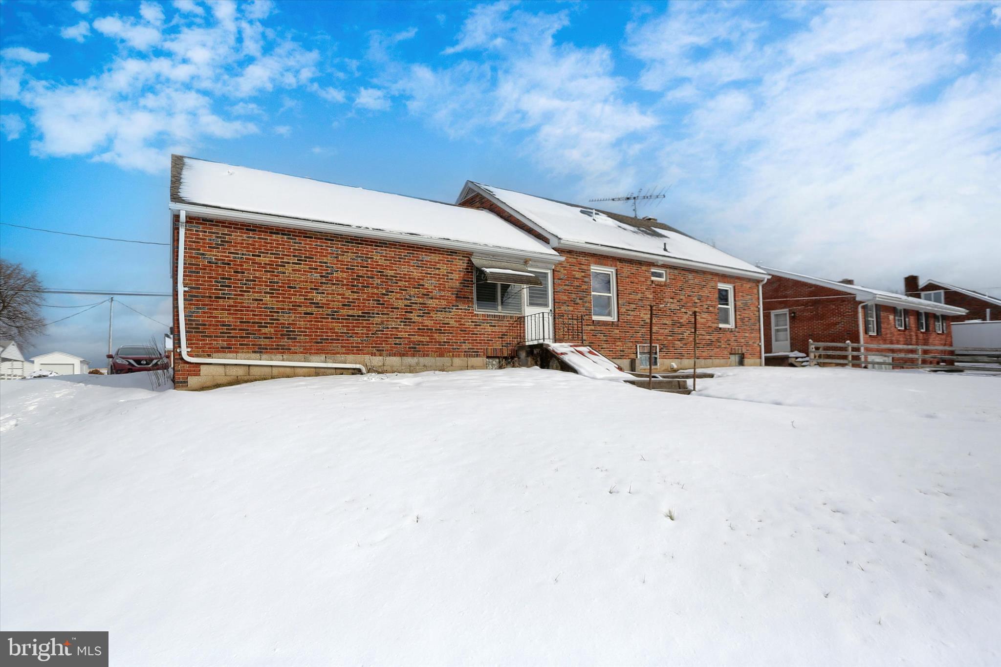 678 Littlestown Road Littlestown, PA 17340 - Photo 35 of 55 a view of a house with backyard and parking space
