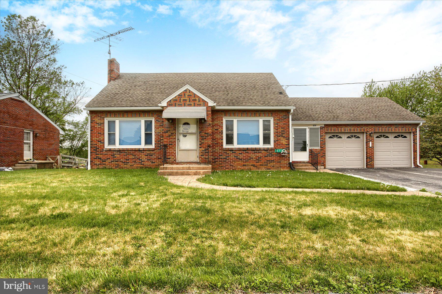678 Littlestown Road Littlestown, PA 17340 - Photo 35 of 53 a front view of a house with a yard