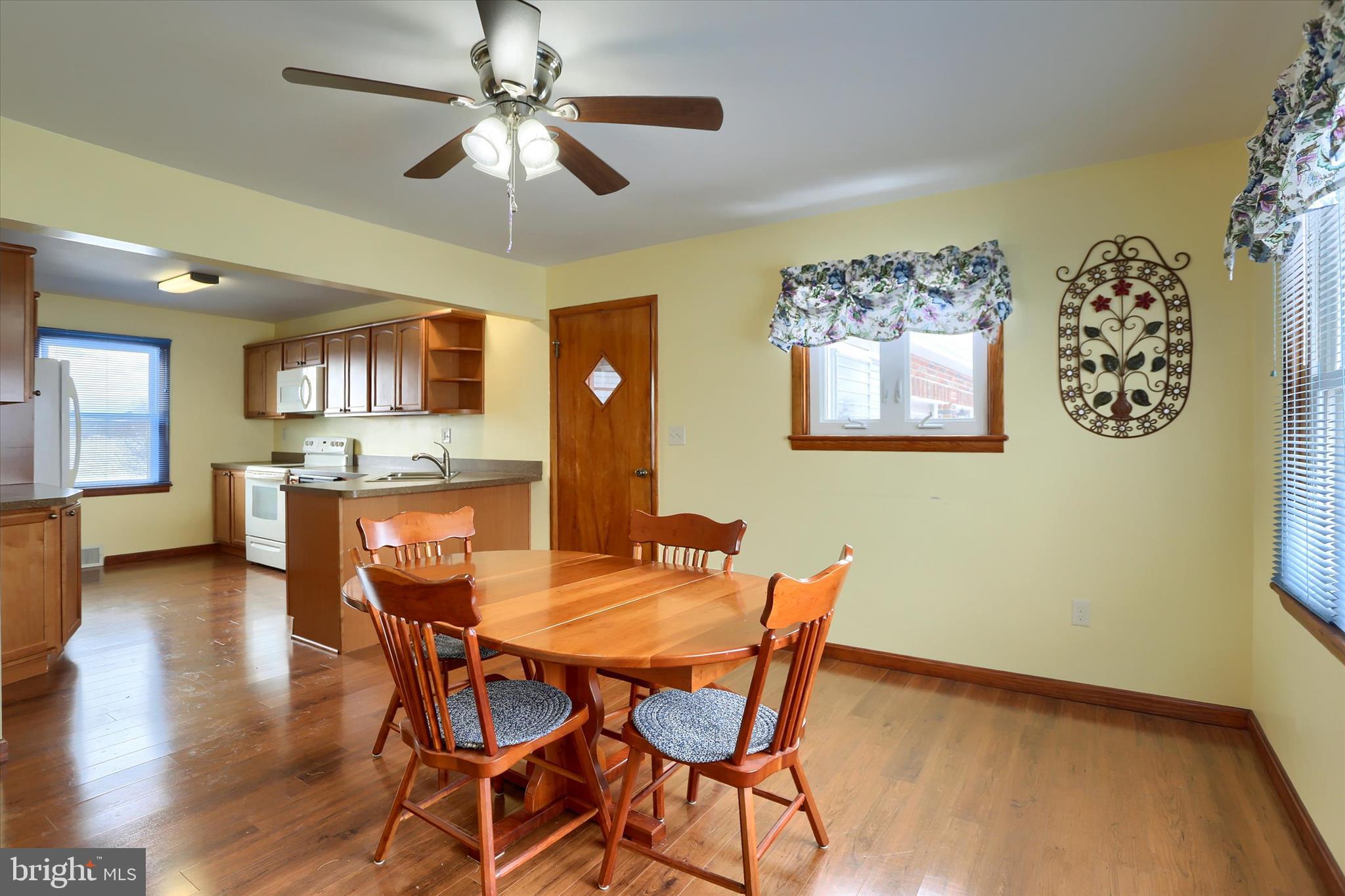 678 Littlestown Road Littlestown, PA 17340 - Photo 5 of 55 a view of a dining room with furniture and wooden floor