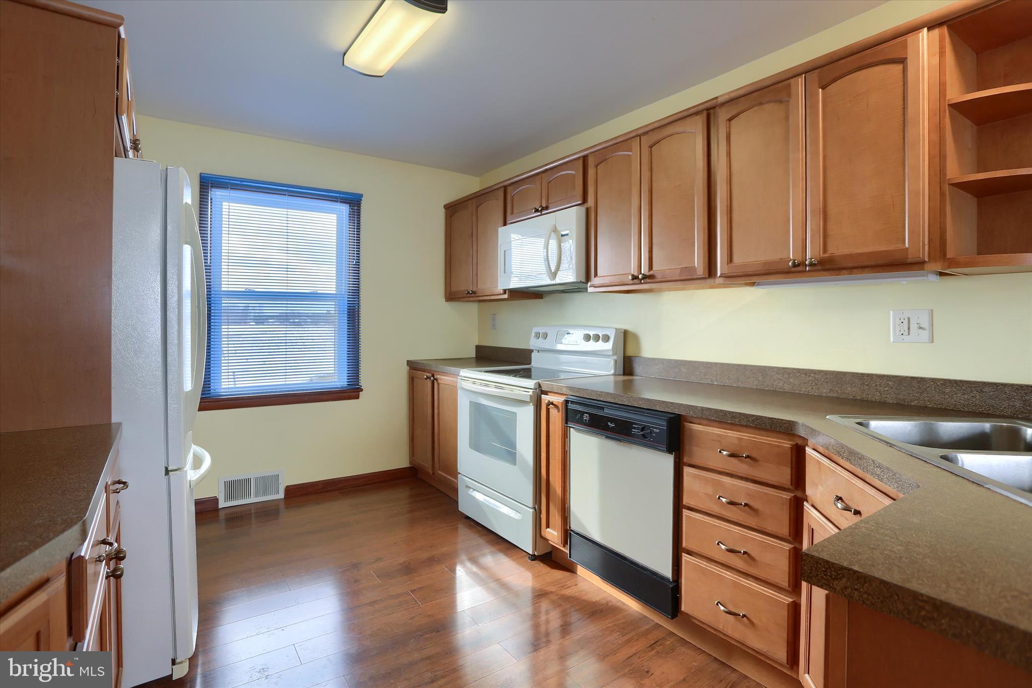 678 Littlestown Road Littlestown, PA 17340 - Photo 8 of 55 a kitchen with stainless steel appliances granite countertop a sink stove and cabinets
