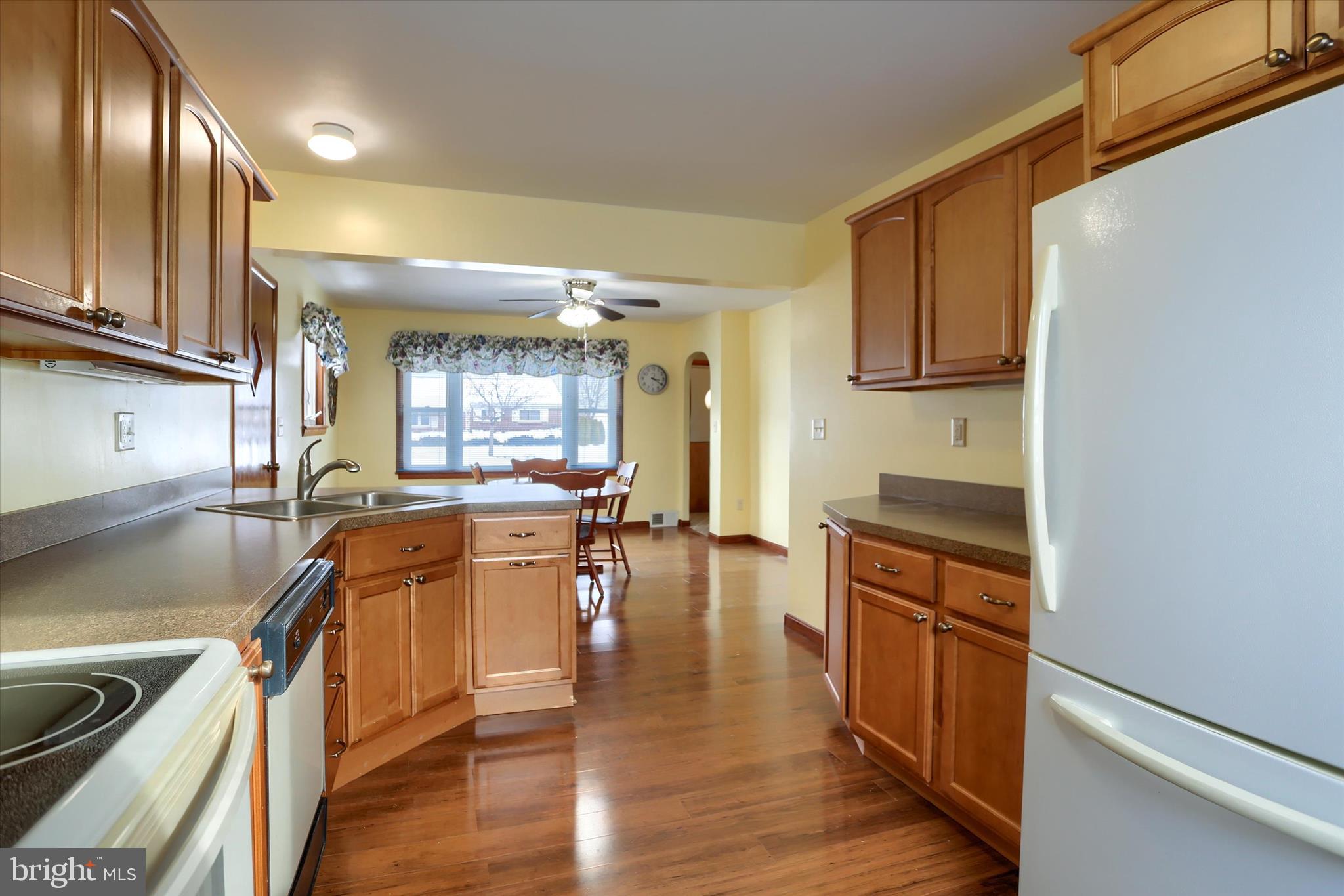 678 Littlestown Road Littlestown, PA 17340 - Photo 9 of 55 a kitchen with a sink appliances cabinets and furniture