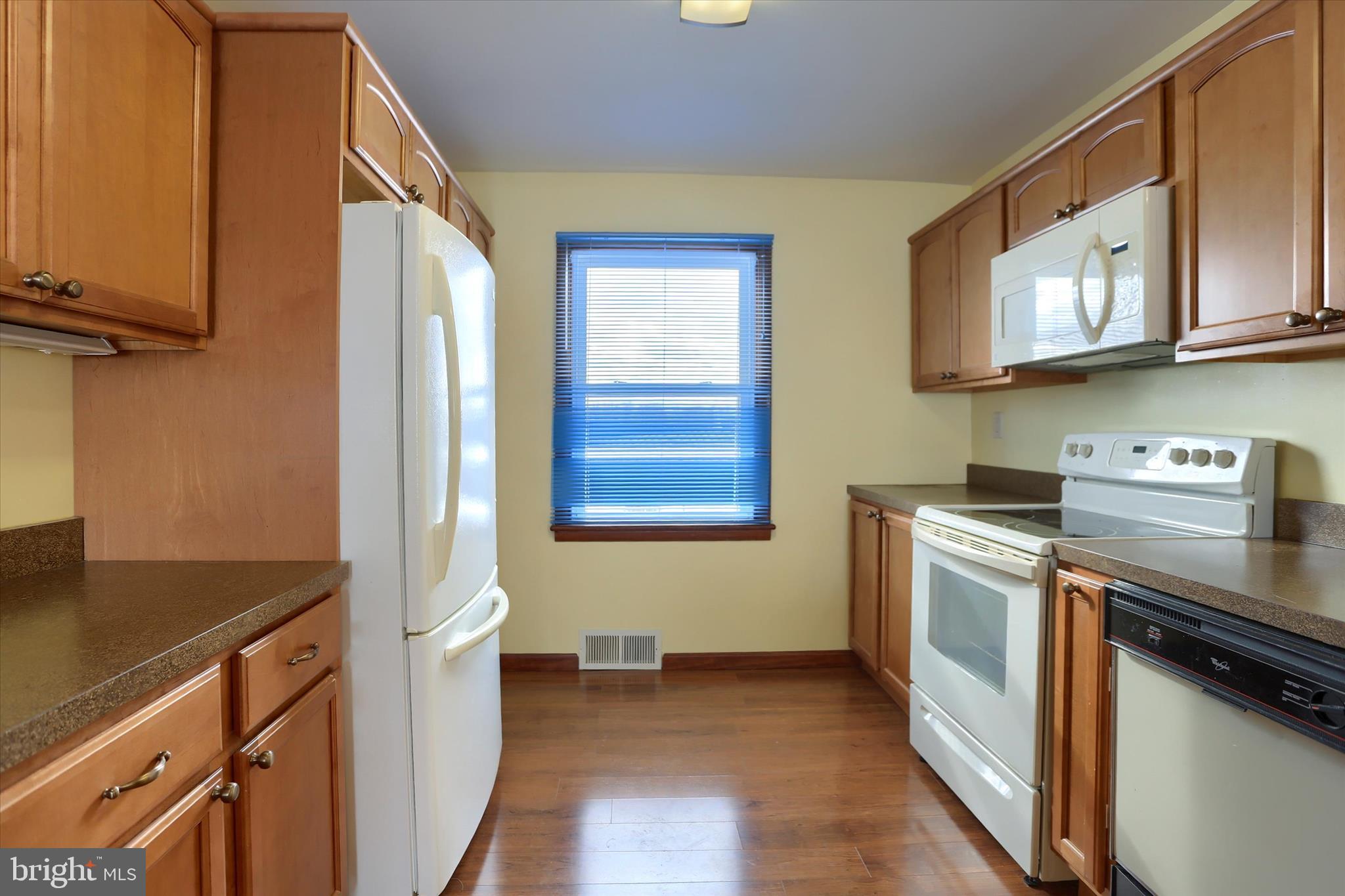 678 Littlestown Road Littlestown, PA 17340 - Photo 10 of 55 a kitchen with stainless steel appliances granite countertop a stove a sink and a microwave