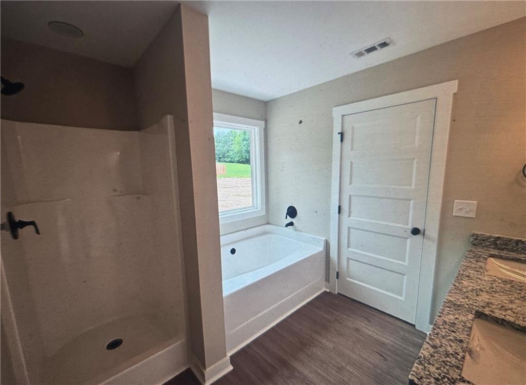 816 Forrest Avenue Rockmart, GA 30153 - Photo 14 of 18 a bathroom with a tub and shower