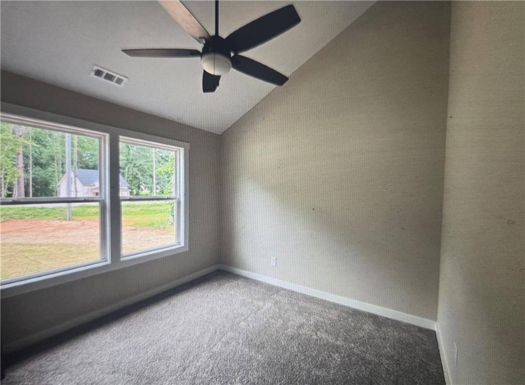816 Forrest Avenue Rockmart, GA 30153 - Photo 15 of 18 an empty room with a window and a fan