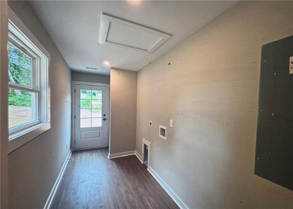 816 Forrest Avenue Rockmart, GA 30153 - Photo 10 of 18 an empty room with wooden floor and windows