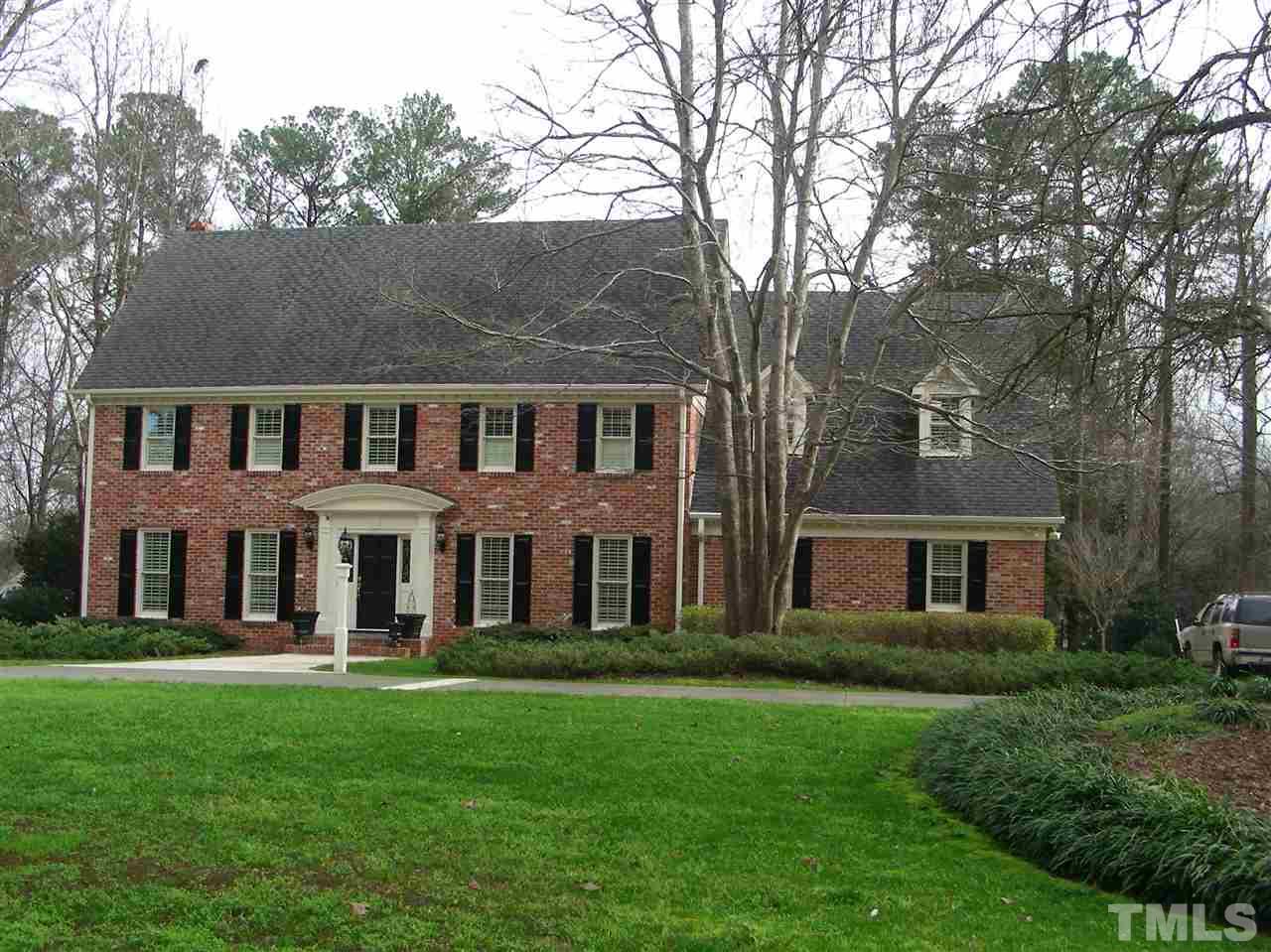6904 North Ridge Drive Raleigh, NC 27615 - Photo 5 of 6 front view of a house with a yard