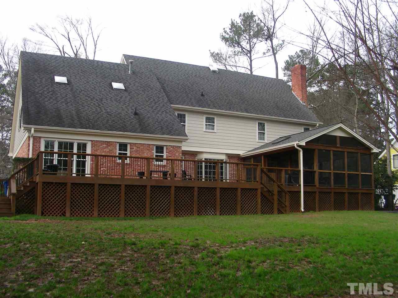 6904 North Ridge Drive Raleigh, NC 27615 - Photo 6 of 6 a view of a house with a backyard