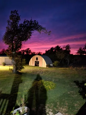 a view of swimming pool from a yard