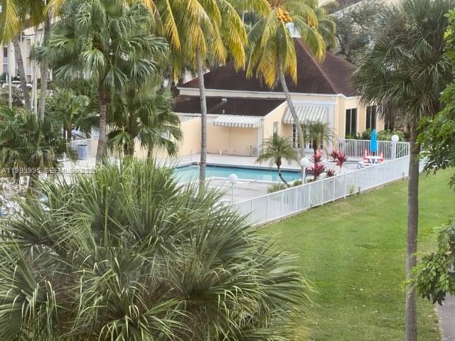 15330 Southwest 106th Terrace, Unit 918 Miami, FL 33196 - Photo 2 of 11 a view of an house with swimming pool and sitting area