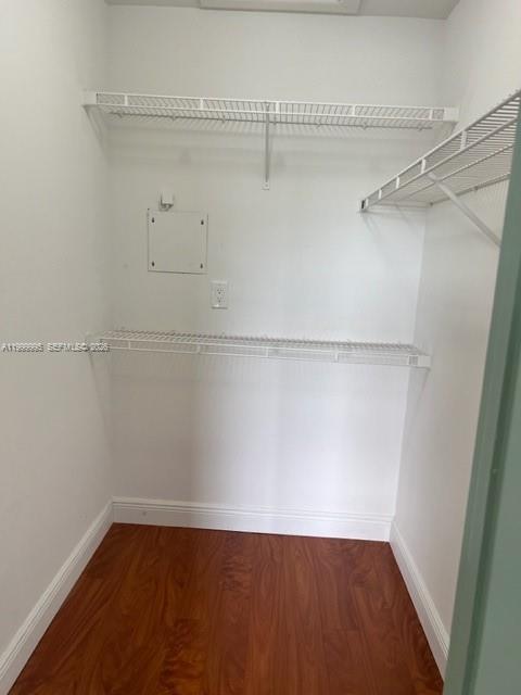 15330 Southwest 106th Terrace, Unit 918 Miami, FL 33196 - Photo 3 of 11 a view of a room with racks on the wall