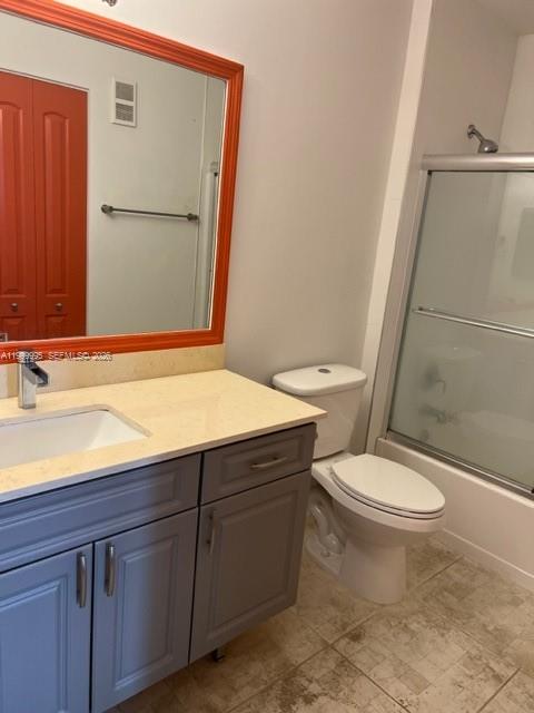15330 Southwest 106th Terrace, Unit 918 Miami, FL 33196 - Photo 8 of 11 a bathroom with a sink a toilet and shower