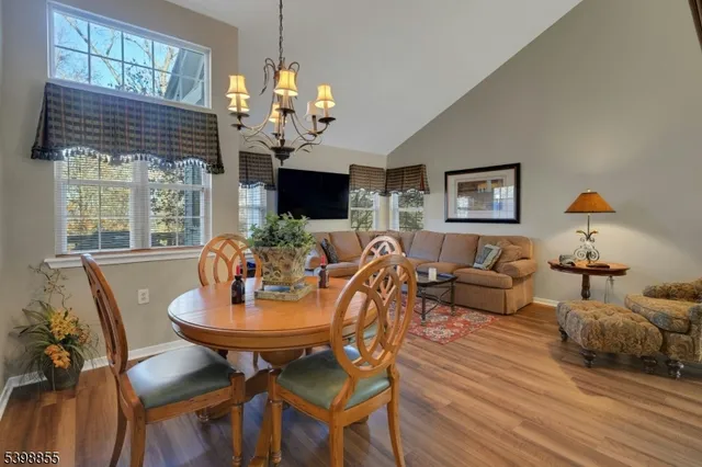 a kitchen with a stove cabinets and a wooden floor