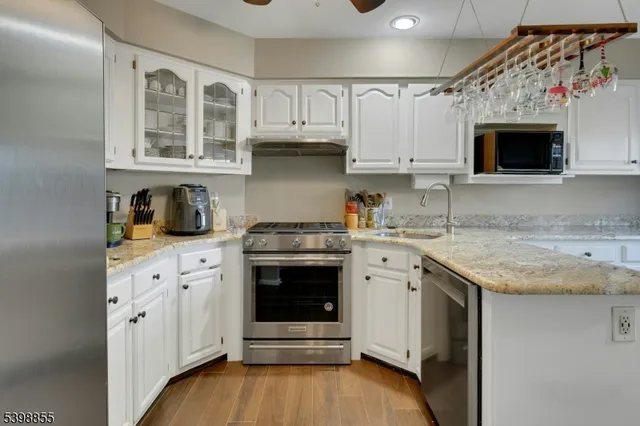 a kitchen with a table chairs and a stove