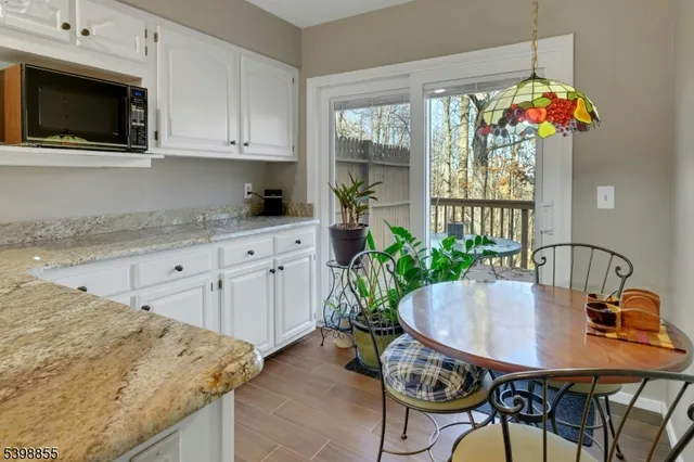 a view of a livingroom with furniture and a flat screen tv