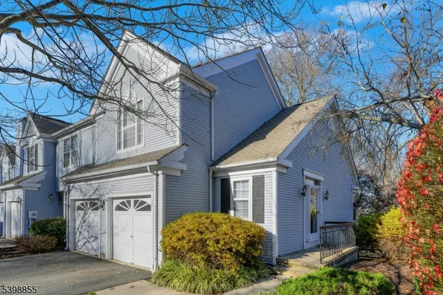 a view of a house with a tree