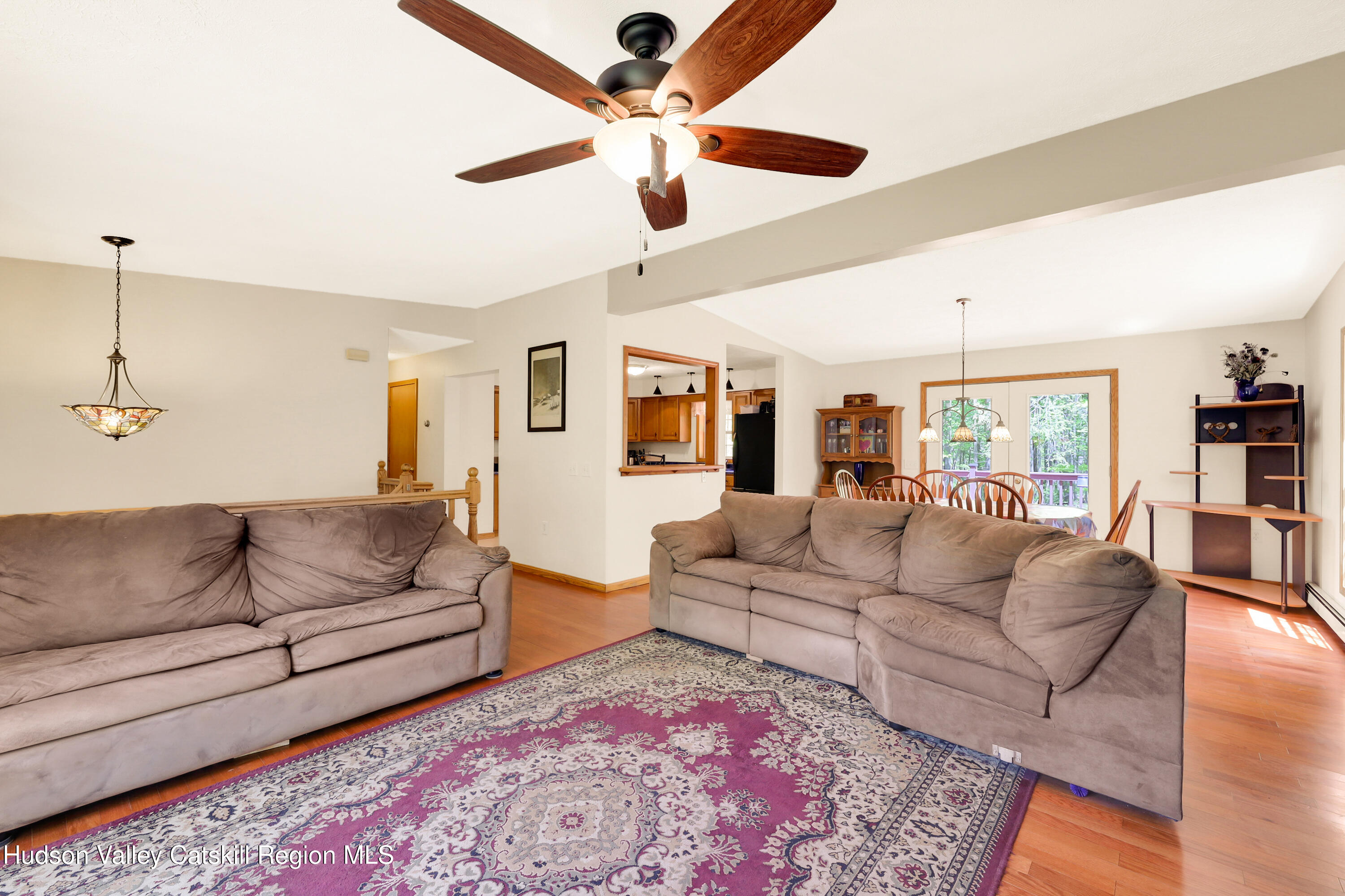 78 Duck Pond Road Stone Ridge, NY 12484 - Photo 5 of 25 a living room with furniture and a wooden floor