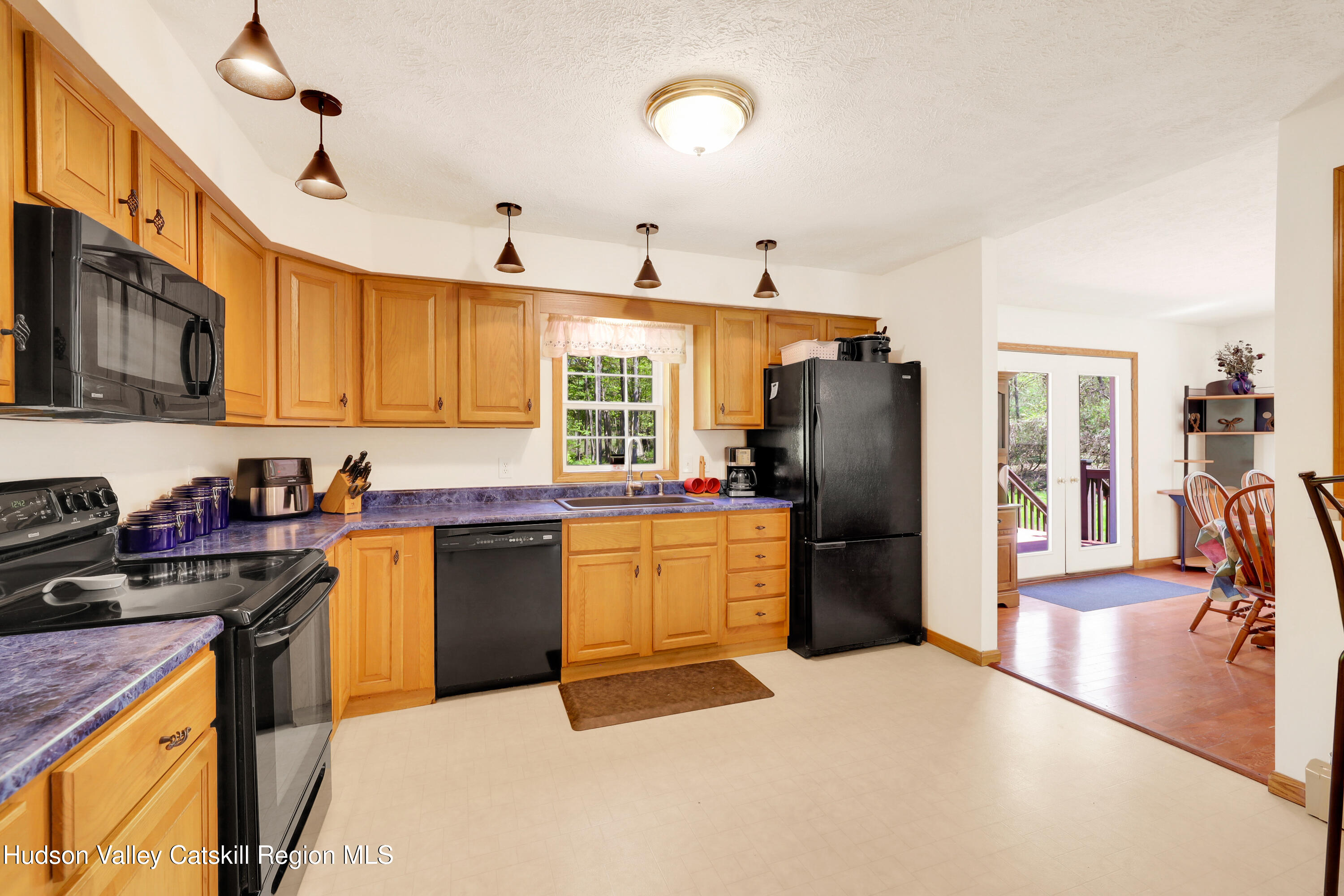 78 Duck Pond Road Stone Ridge, NY 12484 - Photo 8 of 25 a kitchen with a refrigerator stove top oven and sink