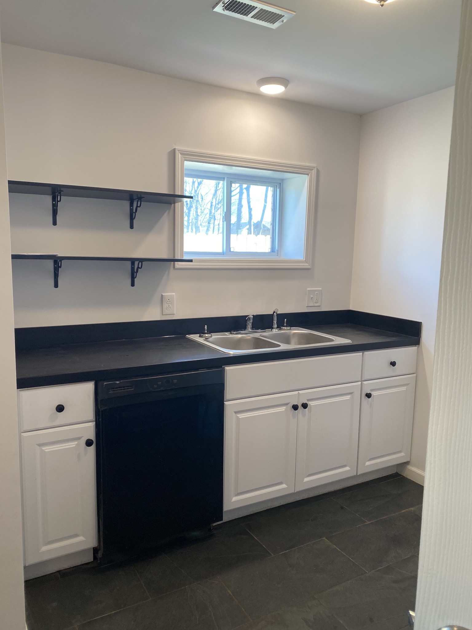 209 Neelys Bend Road, Unit B Madison, TN 37115 - Photo 3 of 11 a kitchen with granite countertop white cabinets and a sink