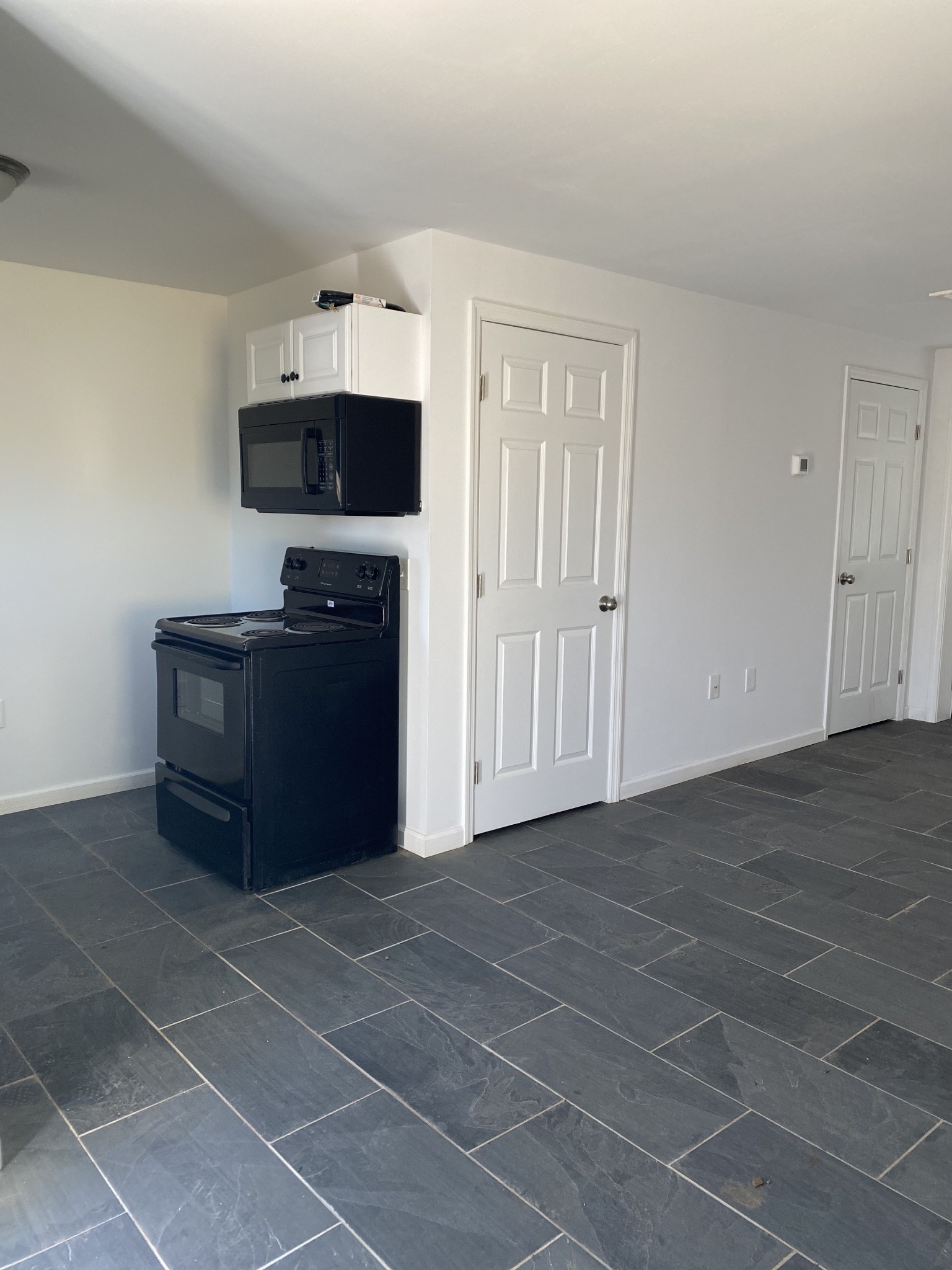 209 Neelys Bend Road, Unit B Madison, TN 37115 - Photo 6 of 11 a view of workspace with furniture and flat screen tv