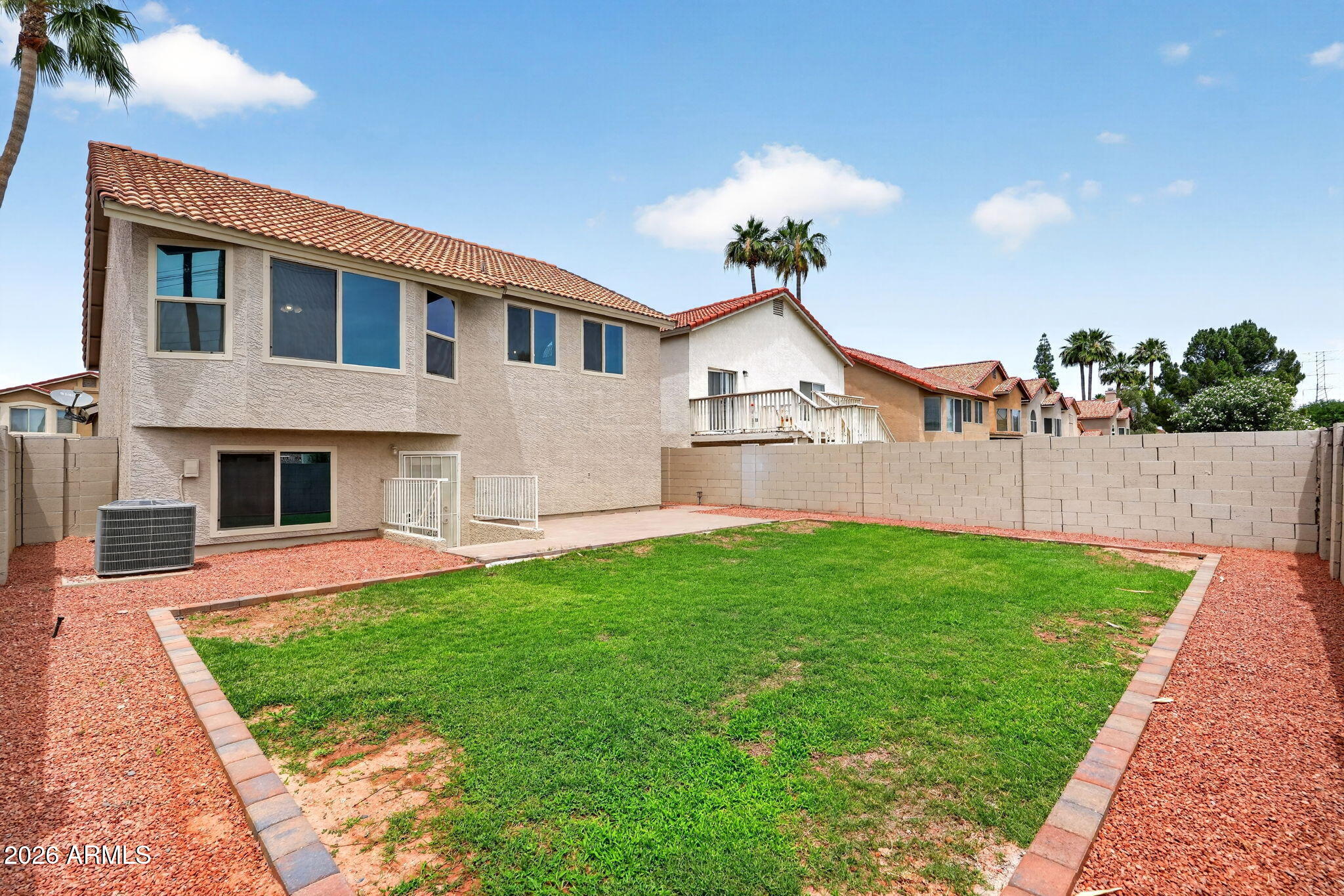1417 East Mineral Road Gilbert, AZ 85234 - Photo 50 of 59 a front view of a house with a yard and potted plants