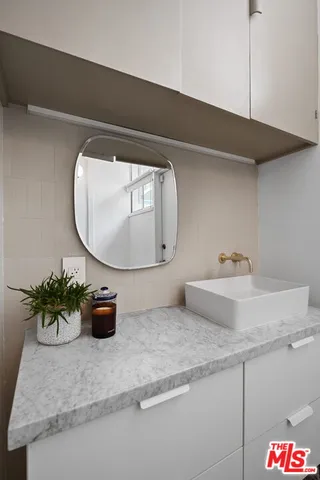 a bathroom with a shower and a window