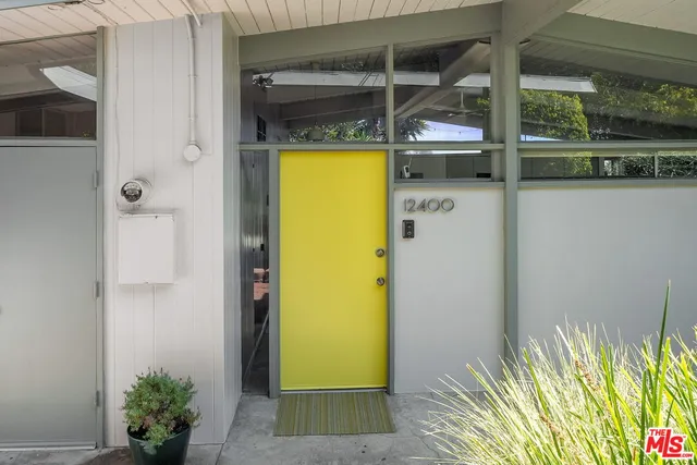 a view of a hallway with a room