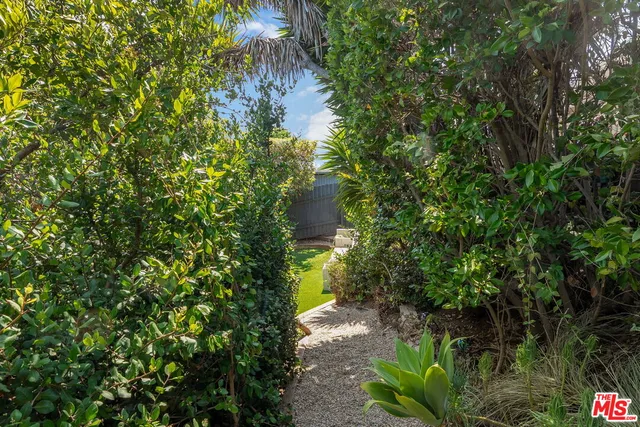 a view of a backyard with a small cabin