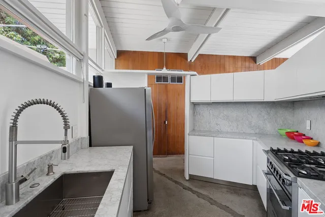 a kitchen with a stove and cabinets