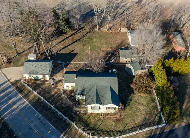a view of a house with a fountain
