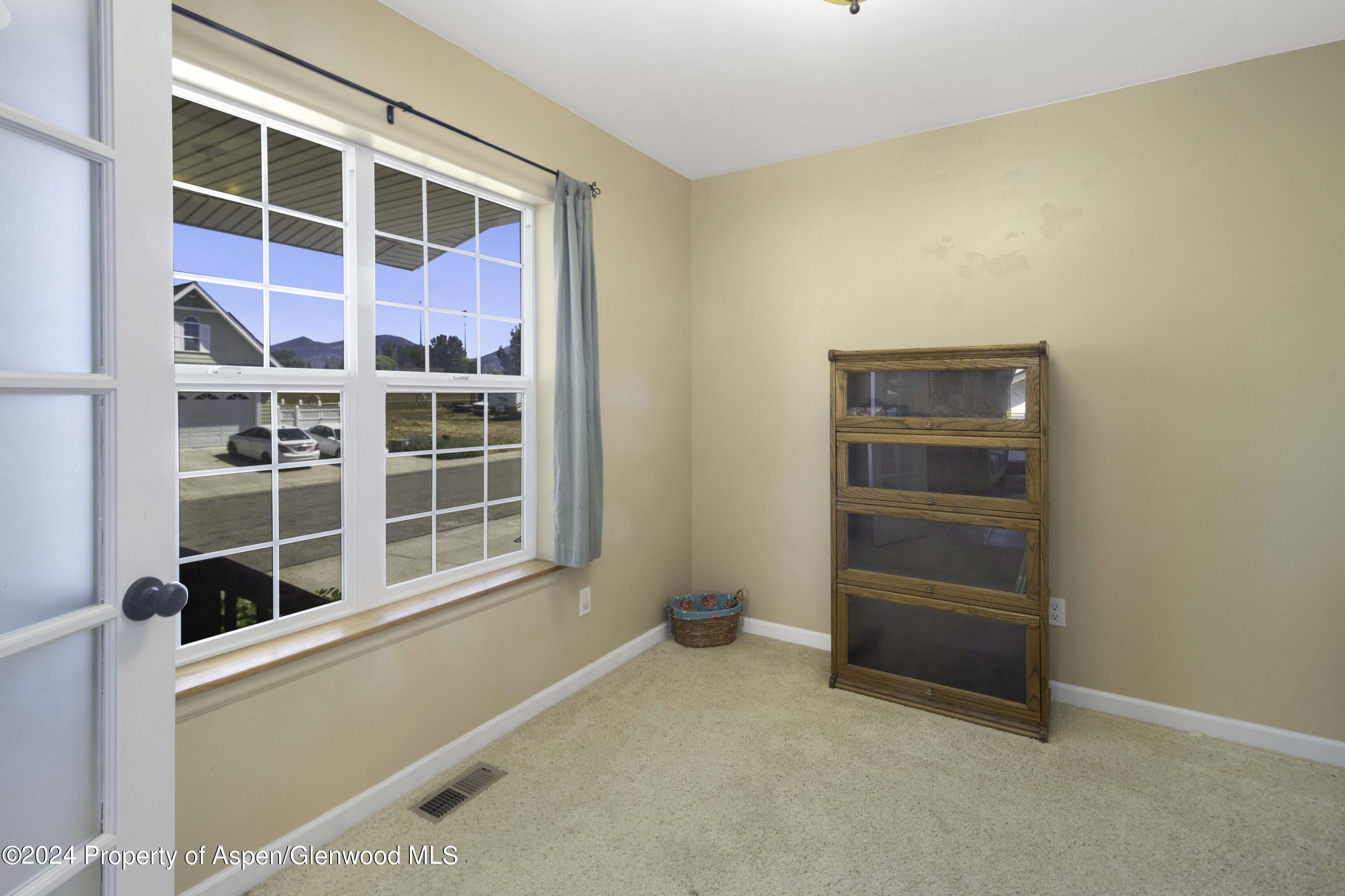 783 East 19th Street Rifle, CO 81650 - Photo 21 of 21 a view of an empty room with a window and cabinet