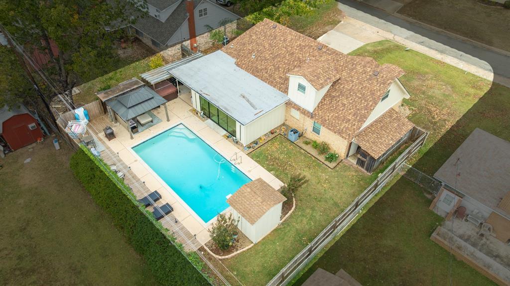 3276 Cleveland Street Paris, TX 75460 - Photo 11 of 31 an aerial view of a house with a swimming pool