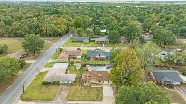 an aerial view of a residential houses with outdoor space