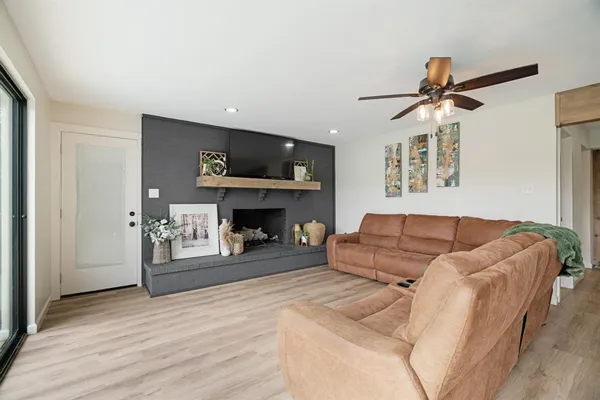a living room with furniture and a large window