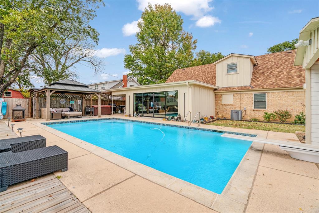3276 Cleveland Street Paris, TX 75460 - Photo 30 of 31 a view of house with swimming pool outdoor seating