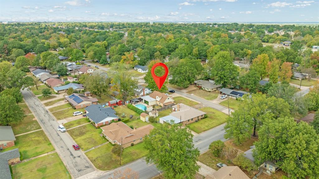 3276 Cleveland Street Paris, TX 75460 - Photo 5 of 31 a aerial view of a house with a yard and lake view