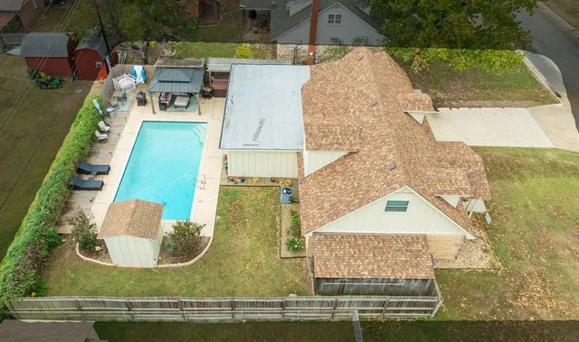 an aerial view of a house with a garden