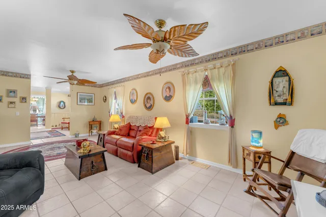 a room with furniture a flat screen tv and a view of living room