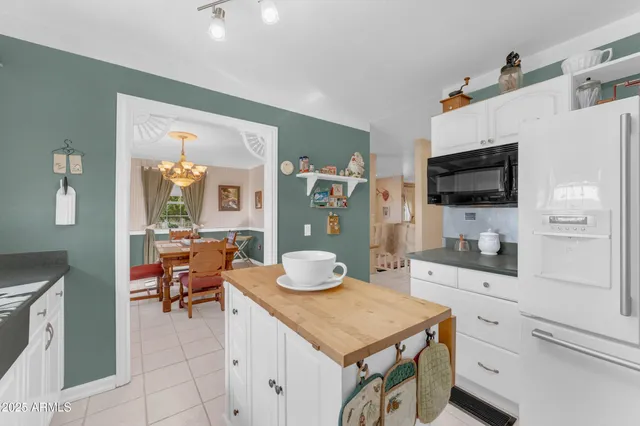 a bathroom with a sink mirror and toilet