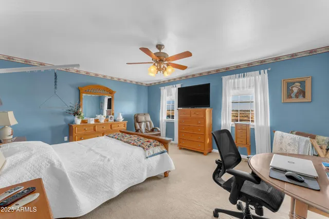 a view of a balcony with a floor to ceiling window next to a yard