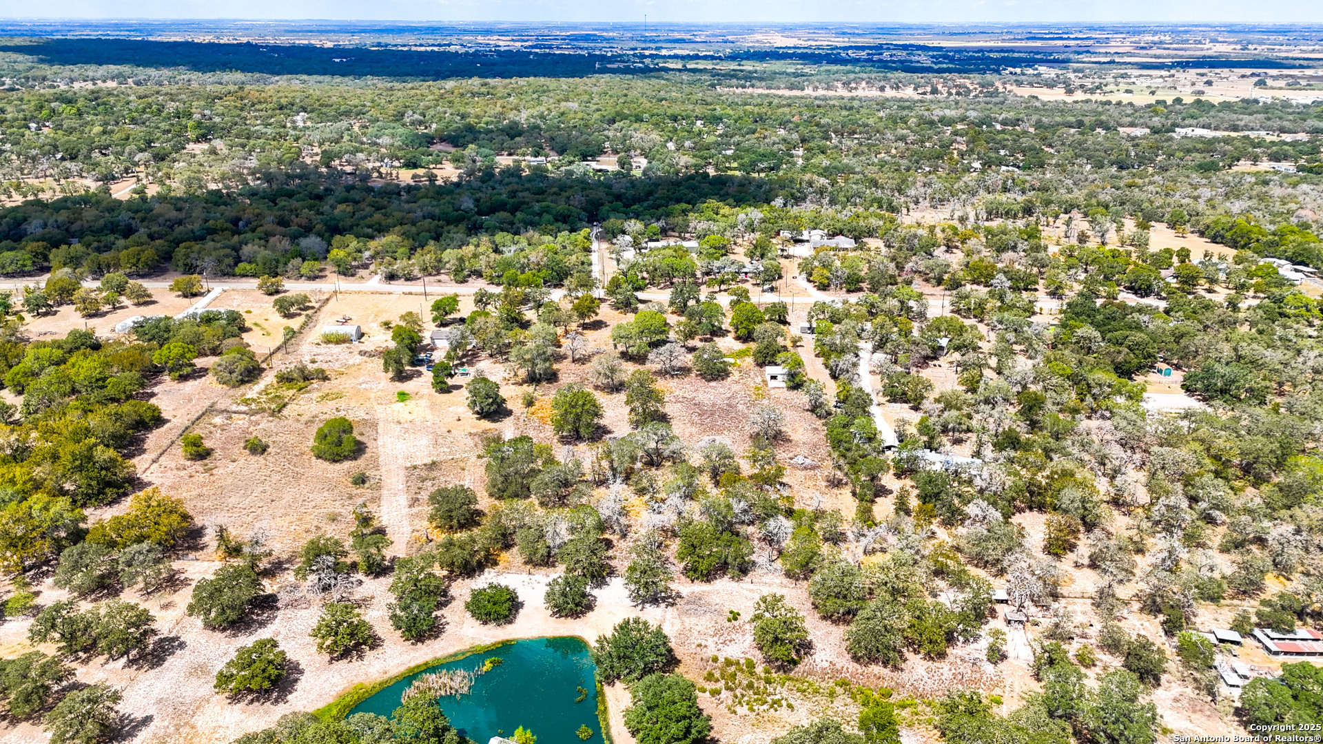 141 Oak Hill Road La Vernia, TX 78121 - Photo 16 of 18 a view of a city from a yard