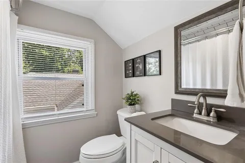 a kitchen with stainless steel appliances granite countertop a sink and cabinets