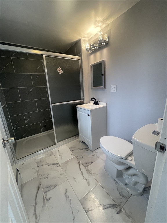 59 High Street Warren, MA 01083 - Photo 10 of 42 a bathroom with a toilet a sink and mirror