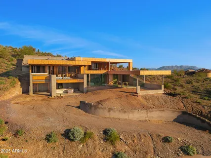 a view of a swimming pool with an outdoor seating
