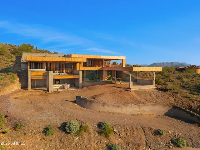 a view of a swimming pool with an outdoor seating