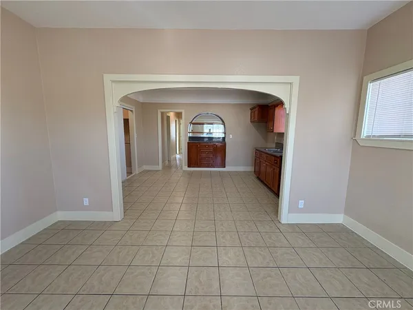 a large kitchen with stainless steel appliances granite countertop a stove and a sink