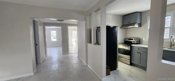 a view of a kitchen from the hallway