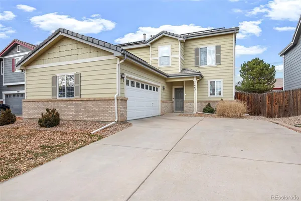 a front view of a house with a garage